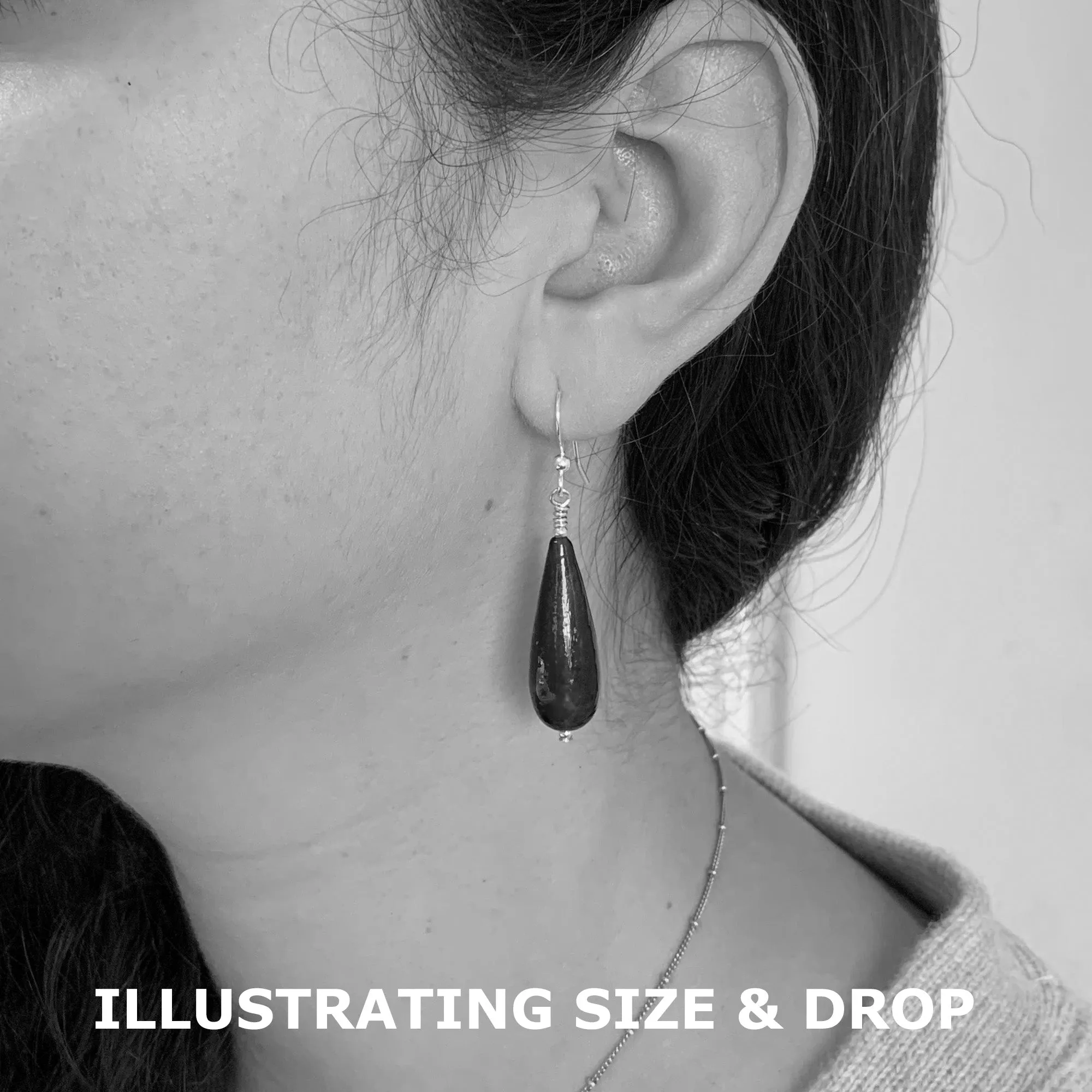 Earrings with amethyst swirl over white gold Murano glass long pear drops